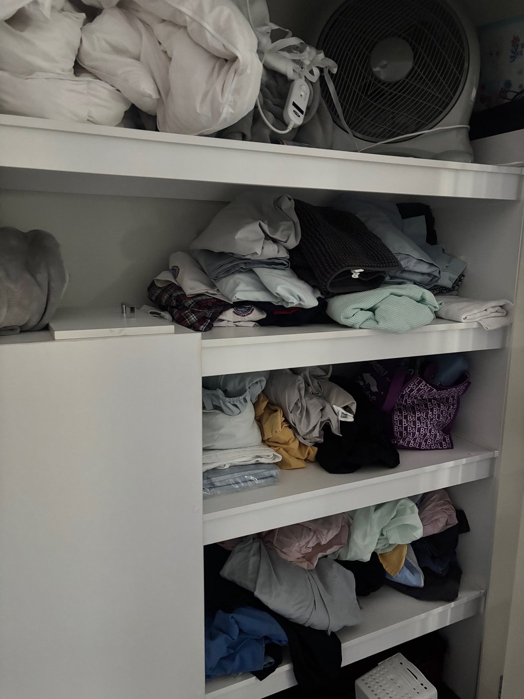 Messy wardrobe before